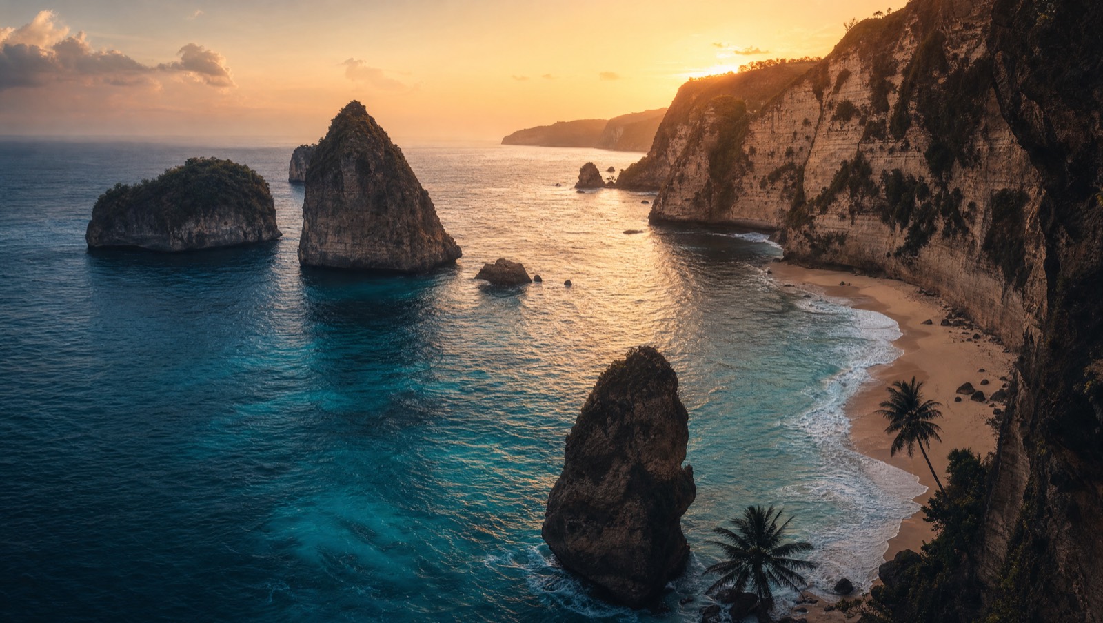 Bali cliff beach with turquoise water at golden hour