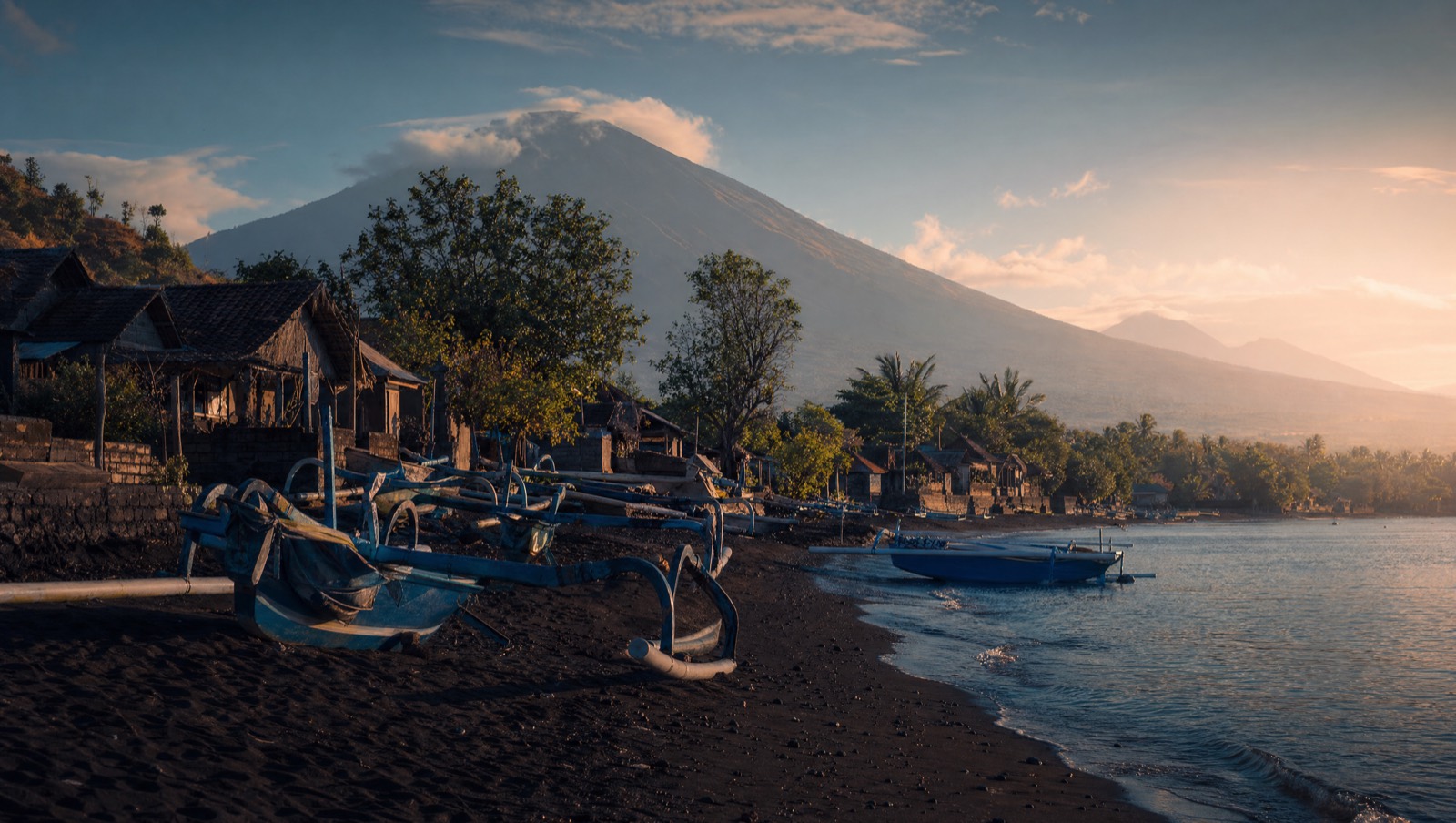 Traditional fishing boats on black sand at Tejakula, northeast Bali