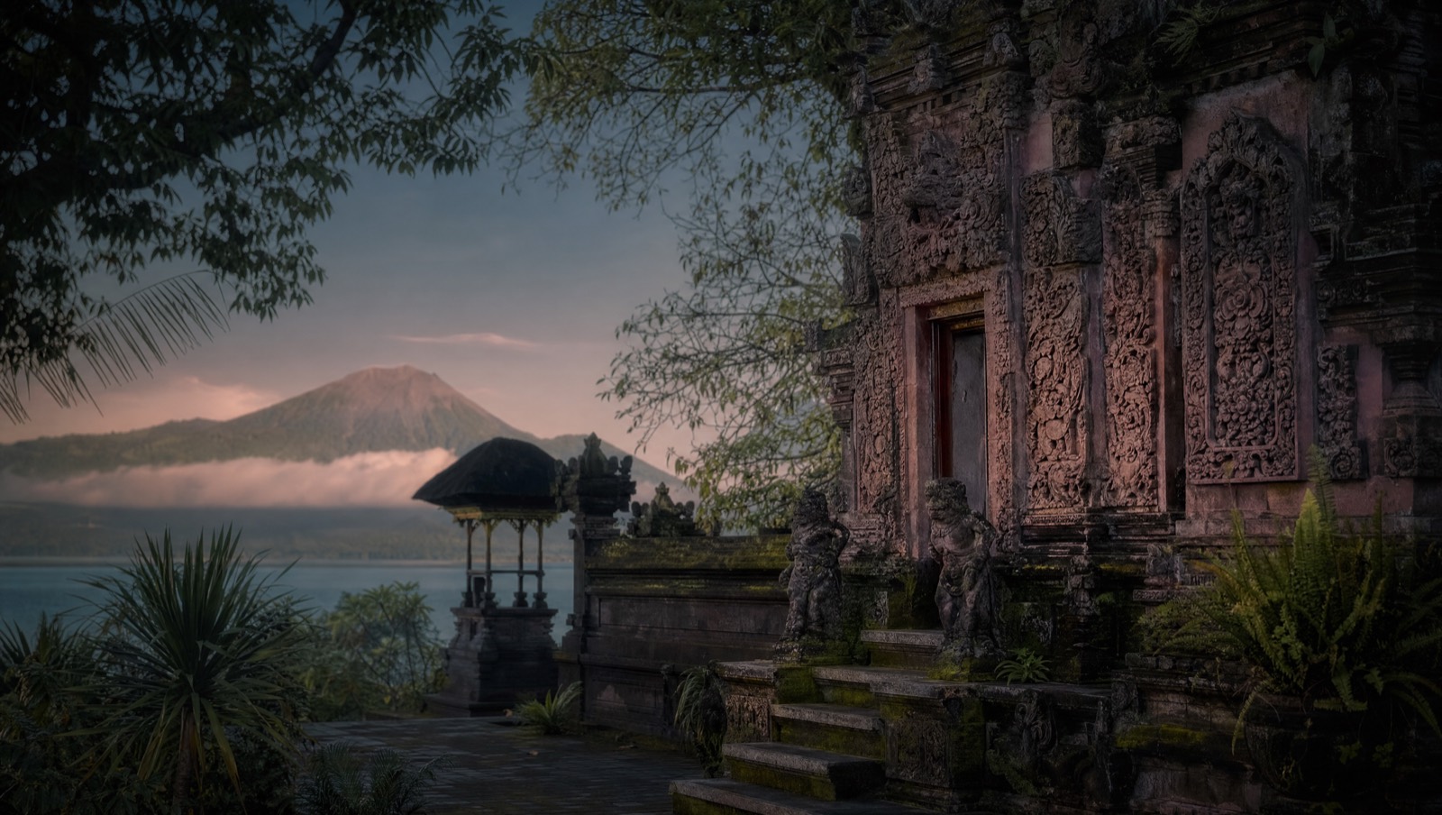 Carved pink-sandstone temple reliefs in north Bali