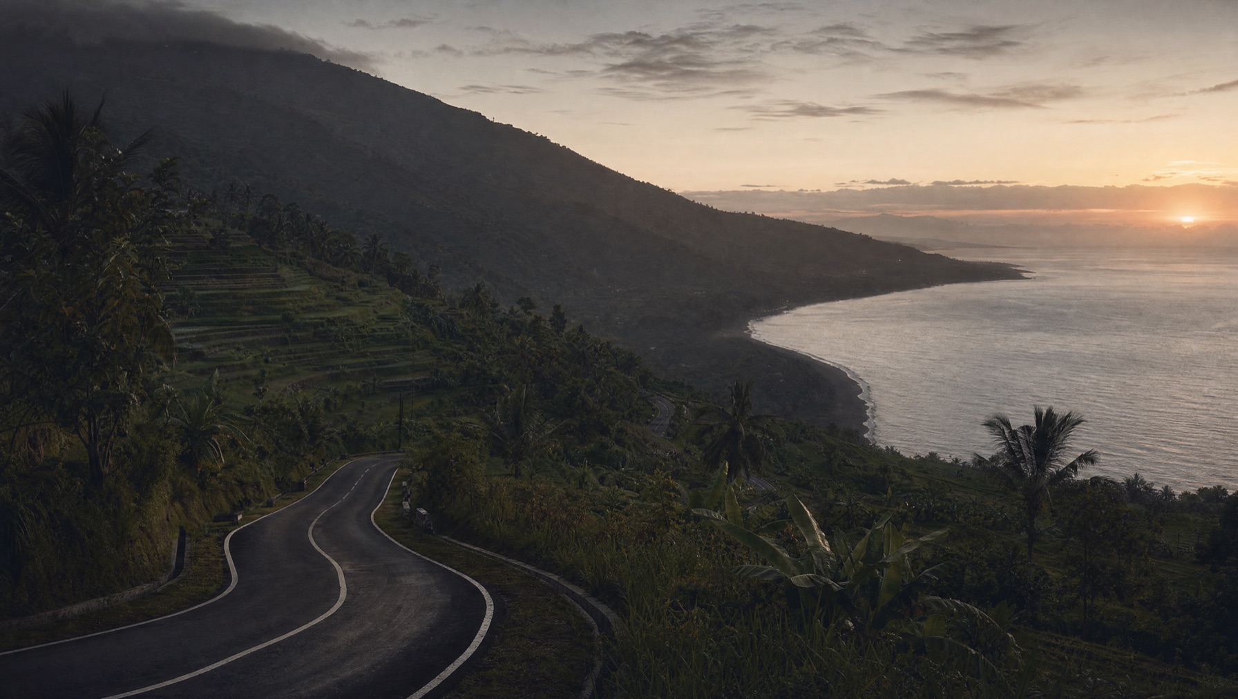 Winding mountain road descending toward the north Bali coast